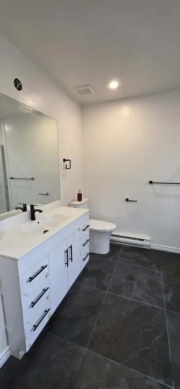 White vanity with black fixtures